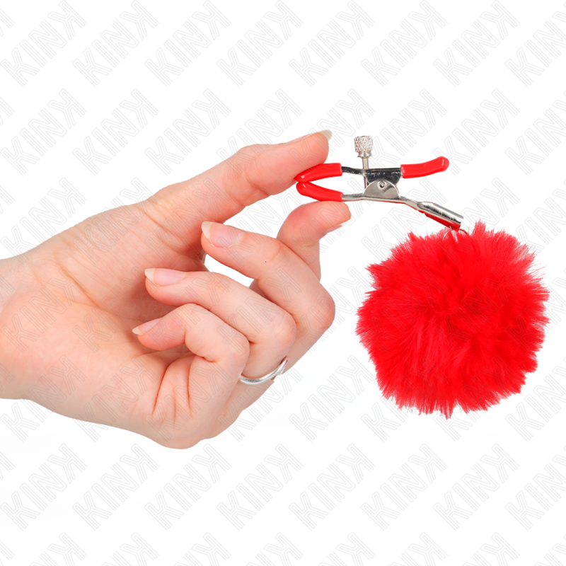 KINK – Pince à tétons avec pompons en fourrure rouge